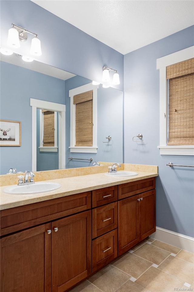 1143 S Saint Paul St, Denver, CO 80210 - full bath with double vanity and baseboards