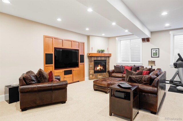 1143 S Saint Paul St, Denver, CO 80210 - living room with light carpet, recessed lighting, baseboards, and a brick fireplace