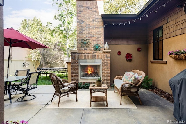 1143 S Saint Paul St, Denver, CO 80210 - view of patio with an outdoor brick fireplace