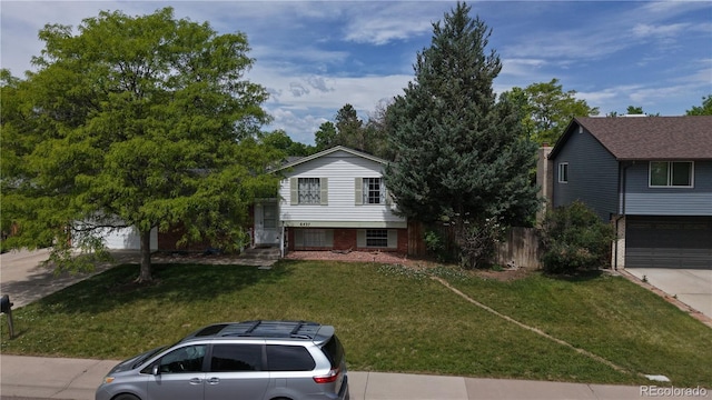 6437 W Arbor Dr, Littleton, CO 80123 - split level home with a garage and driveway