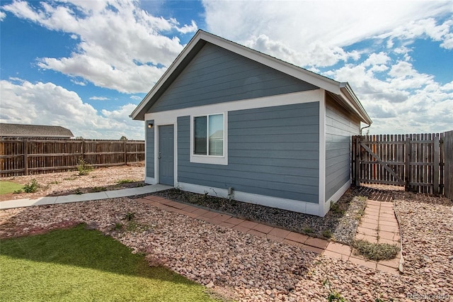 view of side of property featuring a fenced backyard