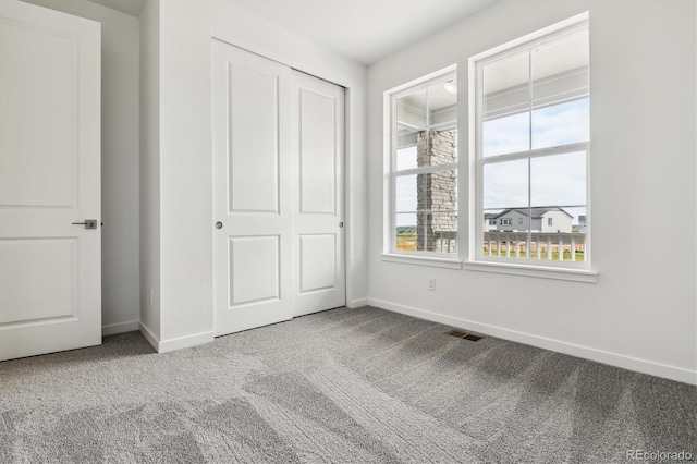 39161 Anthony St, Elizabeth, CO 80107 - unfurnished bedroom with carpet flooring, baseboards, and a closet