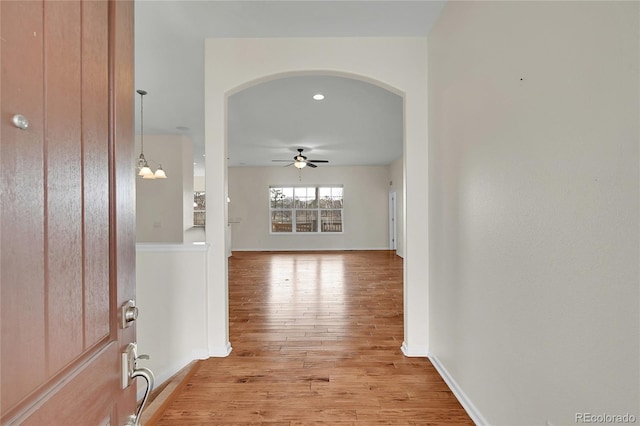 corridor with light wood-type flooring