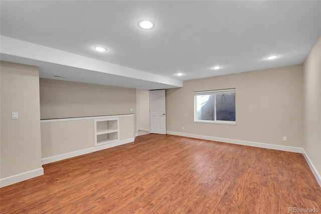 basement featuring hardwood / wood-style floors