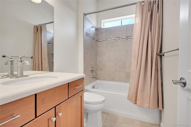 full bathroom featuring vanity, tile patterned floors, shower / bath combination with curtain, and toilet