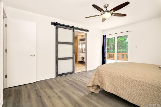 969 Pulpit Rock Ct, Colorado Springs, CO 80918 - bedroom with a barn door, access to outside, wood finished floors, ceiling fan, and ensuite bath