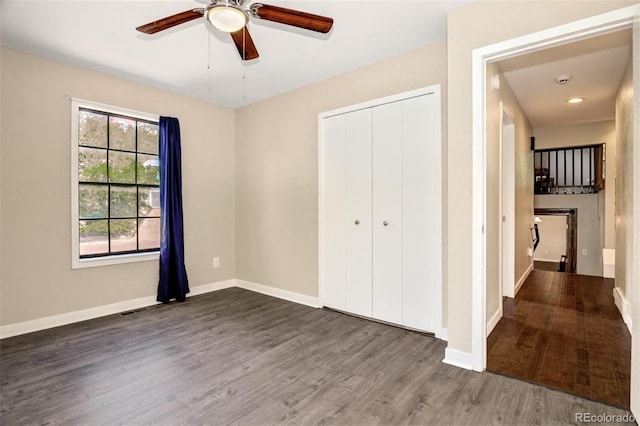 969 Pulpit Rock Ct, Colorado Springs, CO 80918 - unfurnished bedroom featuring wood finished floors, a closet, baseboards, and ceiling fan