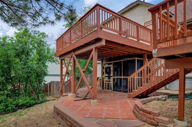 969 Pulpit Rock Ct, Colorado Springs, CO 80918 - view of patio / terrace with a sunroom, a wooden deck, and stairs