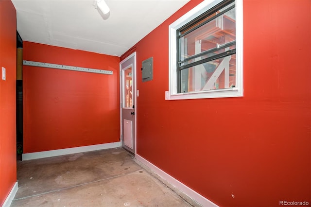 969 Pulpit Rock Ct, Colorado Springs, CO 80918 - hallway featuring unfinished concrete flooring and baseboards