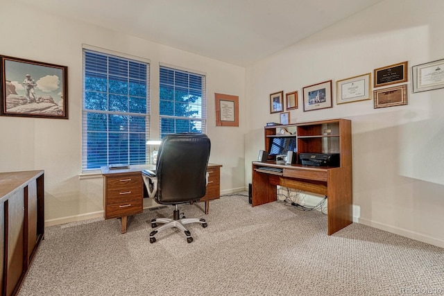 office space featuring light colored carpet and baseboards