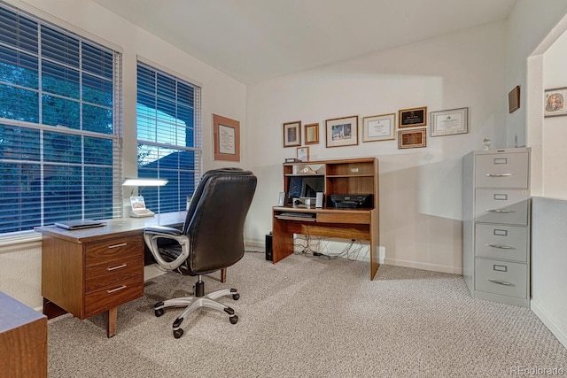 carpeted office featuring baseboards