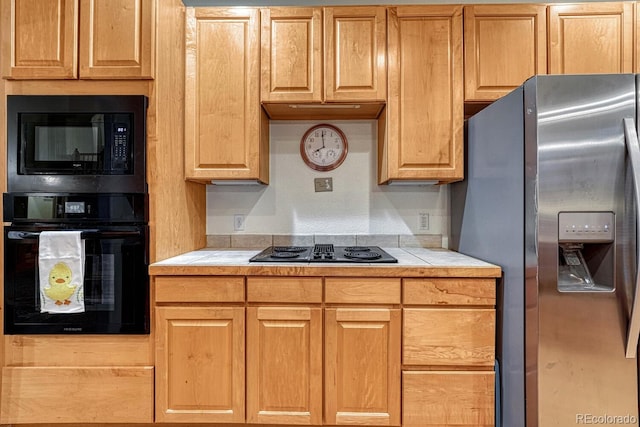 kitchen with black appliances and tile countertops