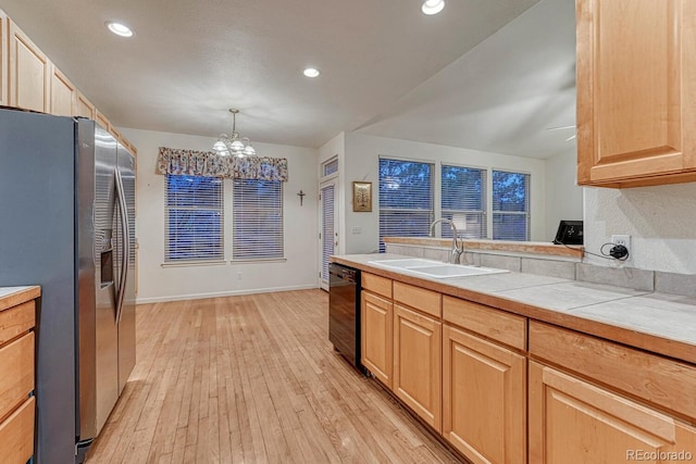 kitchen featuring light wood-style floors, stainless steel fridge with ice dispenser, a sink, dishwasher, and a notable chandelier