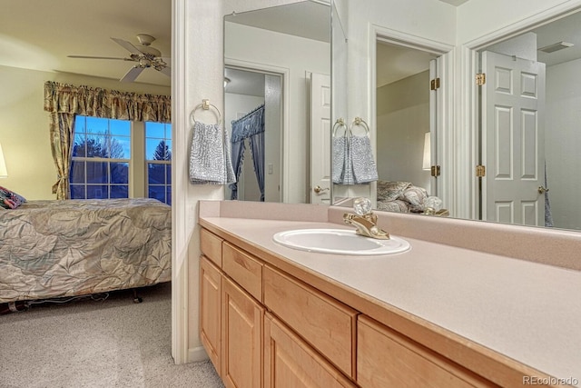 bathroom featuring vanity, visible vents, a ceiling fan, and connected bathroom