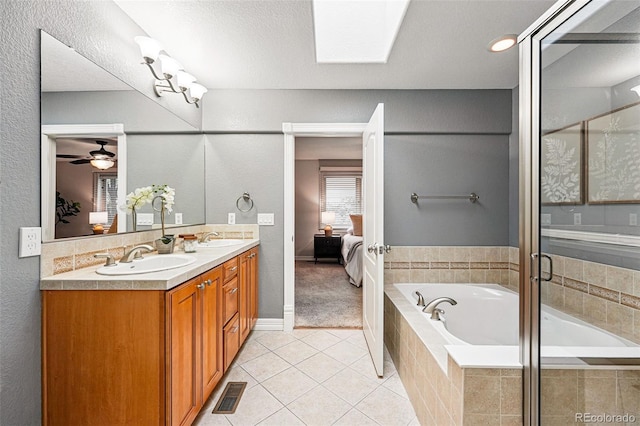2319 Decatur St, Denver, CO 80211 - ensuite bathroom with a bath, double vanity, tile patterned flooring, ceiling fan, and a shower with shower door