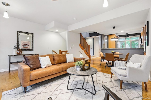 2319 Decatur St, Denver, CO 80211 - living area with light wood finished floors, stairs, and recessed lighting
