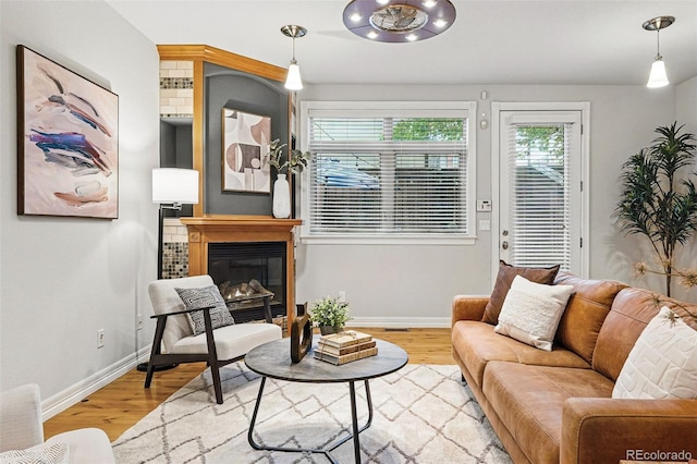 2319 Decatur St, Denver, CO 80211 - living room featuring wood finished floors and a glass covered fireplace