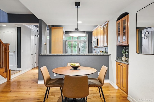 2319 Decatur St, Denver, CO 80211 - dining room with light wood finished floors, stairs, and recessed lighting