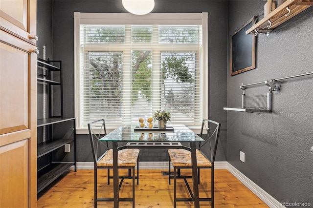 2319 Decatur St, Denver, CO 80211 - dining space with a textured wall and light wood finished floors