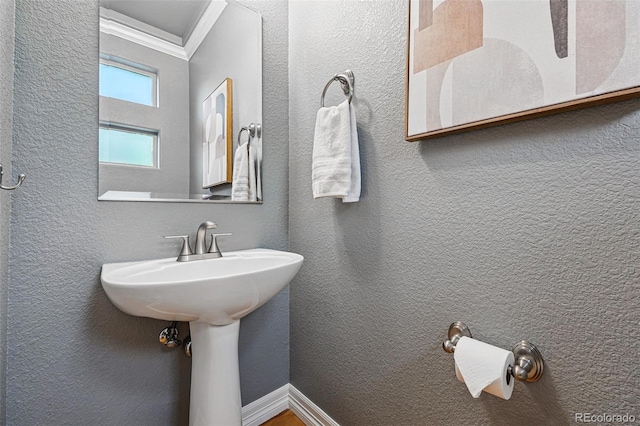 2319 Decatur St, Denver, CO 80211 - bathroom with crown molding and a textured wall