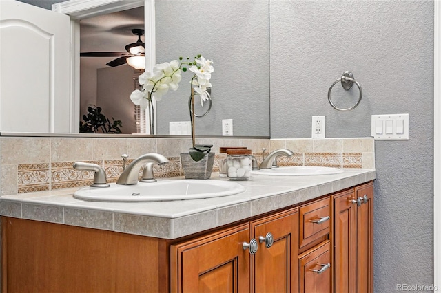 2319 Decatur St, Denver, CO 80211 - full bath featuring backsplash, a textured wall, double vanity, and a ceiling fan