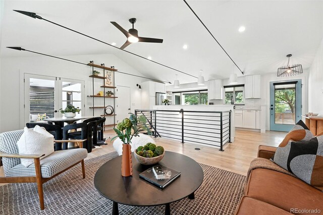 1920 S Niagara St, Denver, CO 80224 - living area featuring light wood finished floors, ceiling fan, lofted ceiling, and recessed lighting