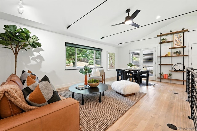 1920 S Niagara St, Denver, CO 80224 - living area with vaulted ceiling, ceiling fan, and light wood-style flooring