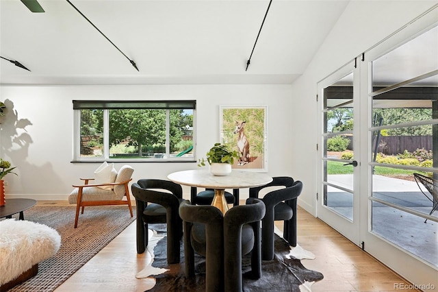 1920 S Niagara St, Denver, CO 80224 - dining area with french doors, light wood-style flooring, and vaulted ceiling