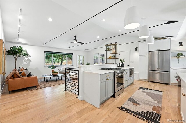 1920 S Niagara St, Denver, CO 80224 - kitchen featuring high end appliances, light countertops, gray cabinets, open shelves, and lofted ceiling