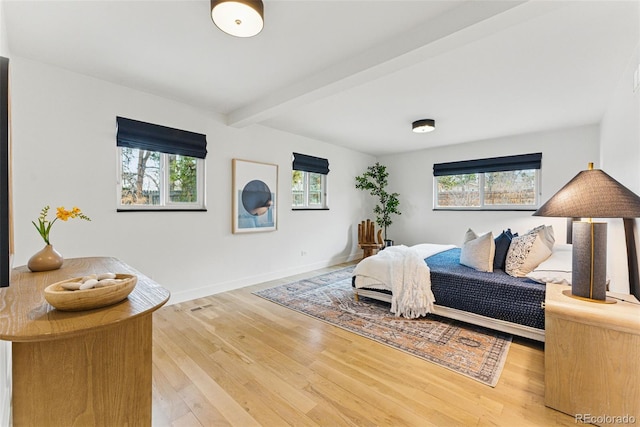 1920 S Niagara St, Denver, CO 80224 - bedroom with multiple windows, beam ceiling, and wood finished floors