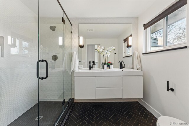 1920 S Niagara St, Denver, CO 80224 - full bathroom with double vanity and a stall shower