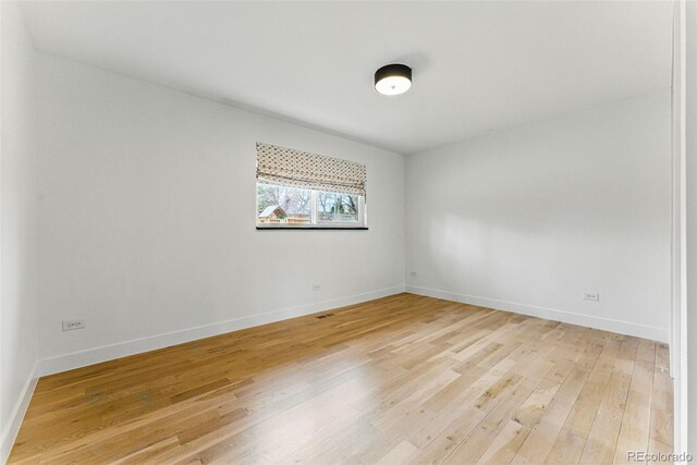 1920 S Niagara St, Denver, CO 80224 - unfurnished room featuring light wood-style floors and baseboards
