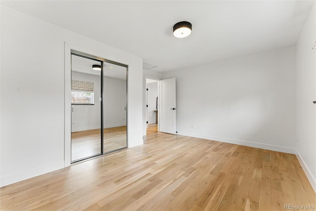 1920 S Niagara St, Denver, CO 80224 - unfurnished bedroom with light wood-type flooring and a closet