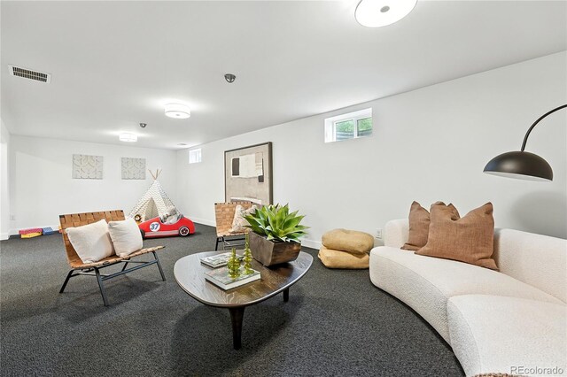1920 S Niagara St, Denver, CO 80224 - carpeted living room featuring baseboards