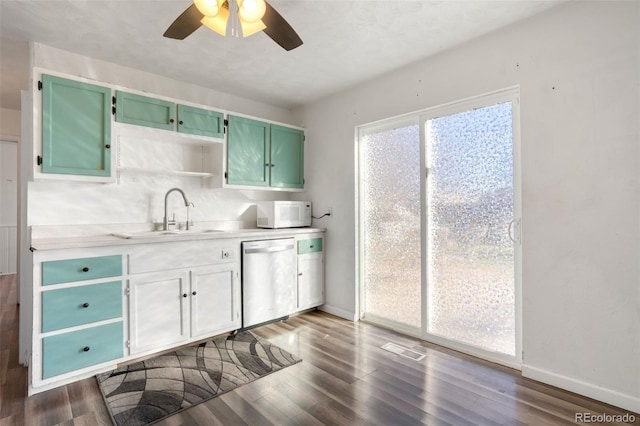 kitchen featuring dark wood-type flooring, ceiling fan, sink, and stainless steel dishwasher