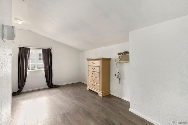 805 5th St, Fort Lupton, CO 80621 - spacious closet featuring vaulted ceiling, wood finished floors, and a wall mounted AC