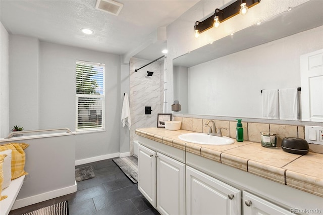 805 5th St, Fort Lupton, CO 80621 - full bath with vanity, a shower, tile patterned floors, and a textured ceiling
