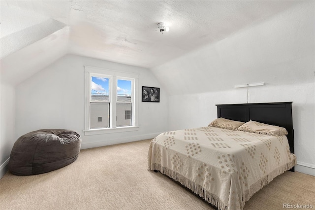 805 5th St, Fort Lupton, CO 80621 - bedroom with lofted ceiling and carpet flooring
