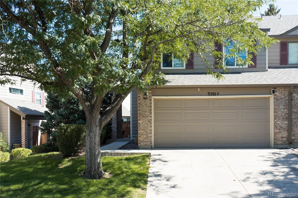 view of front facade with a front lawn and a garage