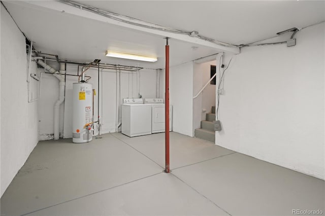 basement with gas water heater and washer and dryer