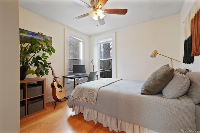 bedroom featuring ceiling fan and light wood-type flooring