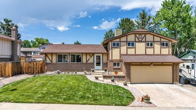6441 W 73rd Pl, Arvada, CO 80003 - tudor-style house with stucco siding, brick siding, concrete driveway, an attached garage, and roof with shingles