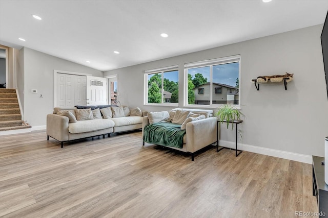 6441 W 73rd Pl, Arvada, CO 80003 - living area featuring stairs, light wood finished floors, lofted ceiling, and recessed lighting