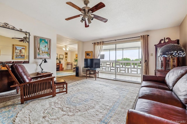 715 S Alton Way Unit 5D, Denver, CO 80247 - carpeted living area with ceiling fan, vaulted ceiling, and a textured ceiling
