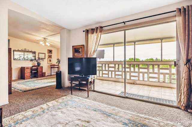 715 S Alton Way Unit 5D, Denver, CO 80247 - living room with carpet flooring, healthy amount of natural light, and ceiling fan