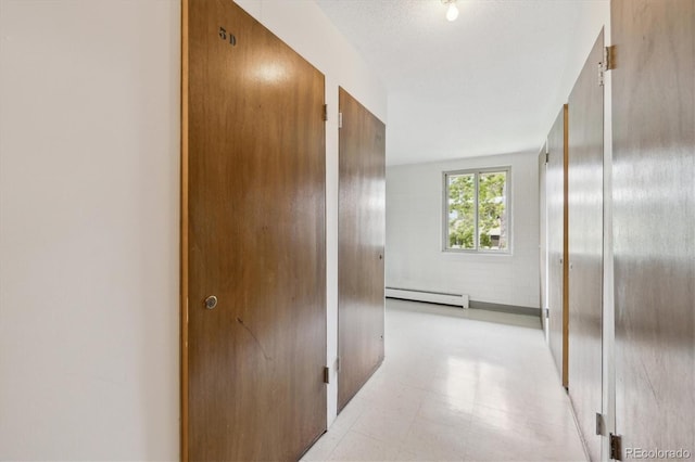 715 S Alton Way Unit 5D, Denver, CO 80247 - hallway featuring baseboard heating and light floors