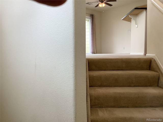 11947 Riverstone Cir Unit 7F, Henderson, CO 80640 - stairs featuring a ceiling fan and a textured wall