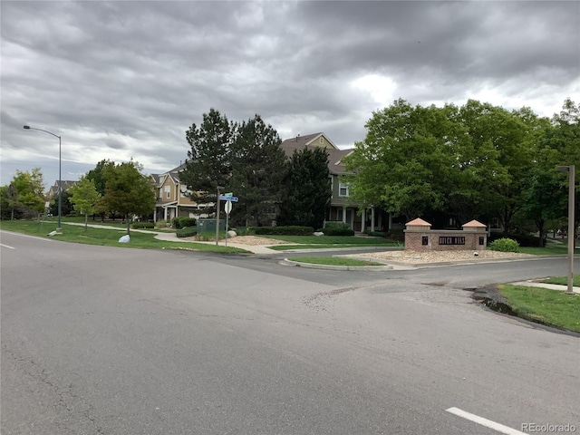 11947 Riverstone Cir Unit 7F, Henderson, CO 80640 - view of asphalt road with street lights and traffic signs