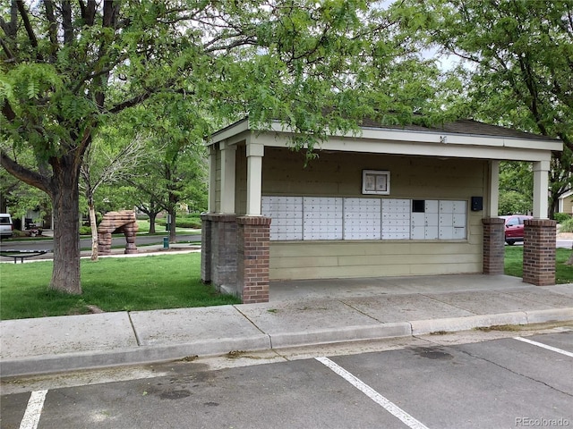 11947 Riverstone Cir Unit 7F, Henderson, CO 80640 - view of home's community with mail area, a yard, and uncovered parking