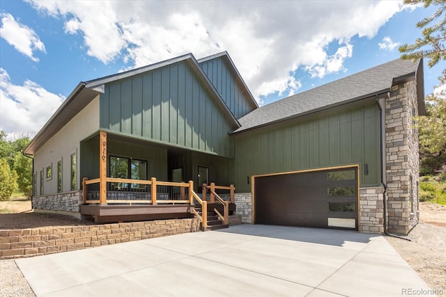 view of front of home with a porch and a garage